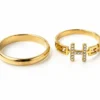 Bague double anneau motif H pavé de strass en acier inoxydable doré