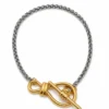 Bracelet chaîne maille palmier argentée avec fermoir nœud marin en T doré bicolore