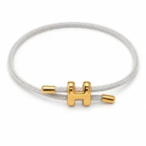 Bracelet cordon tressé blanc avec fermoir motif H en acier inoxydable doré