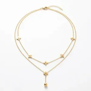 Sautoir double rang en acier inoxydable doré orné de fleurs à quatre pétales et perle pendante